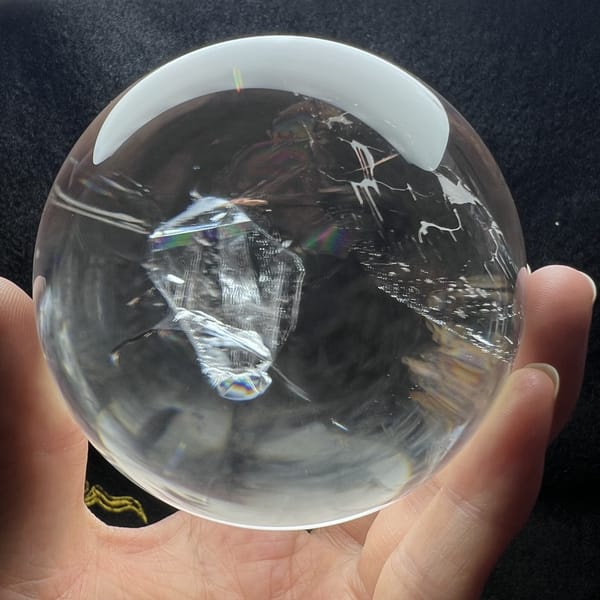 Sphere on black under a softbox, crystal-in-crystal clearly outlined