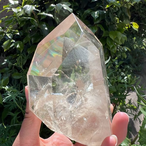 Angled view with a rainbow flash on one face and a misty phantom inside