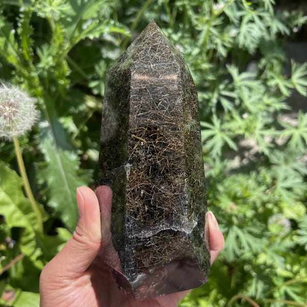 Turned tower showing blue-black rutile mixed with golden strands