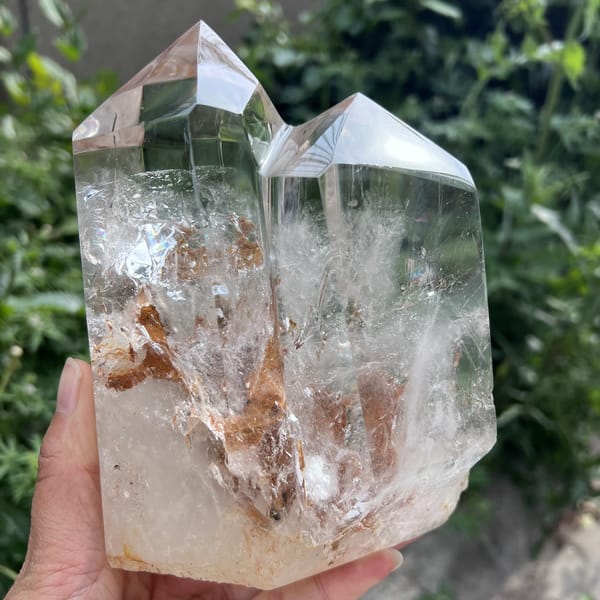 Front face with both points and feathery inclusions in clear quartz