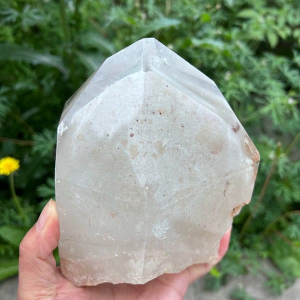 White phantom pyramid set in the middle beneath polished faces