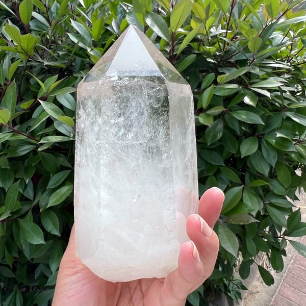 Faceted tip above icy white inclusions in the Himalayan quartz