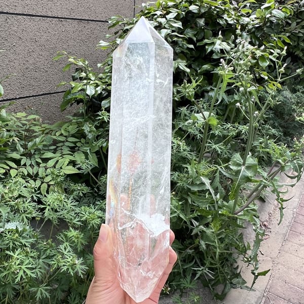 Narrow face with orange rutile tufts and clear tip