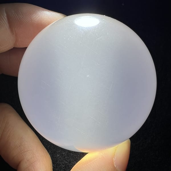 Dark backdrop view of fine rutile sheen in the sphere