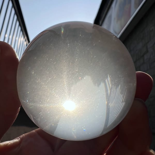 Sunlit sphere with soft star and scattered needle sparkle