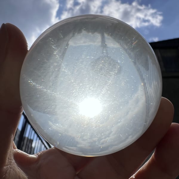 Star low in the sphere with reflections of trees