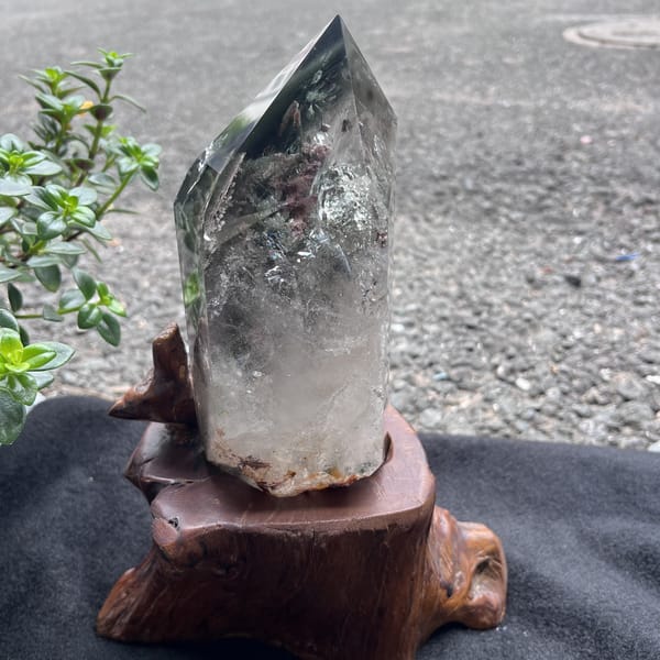 Back of the tower on its stand with clearer quartz toward the base