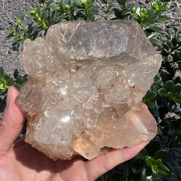 Front view of the skeletal crystal with rutile glinting near the top
