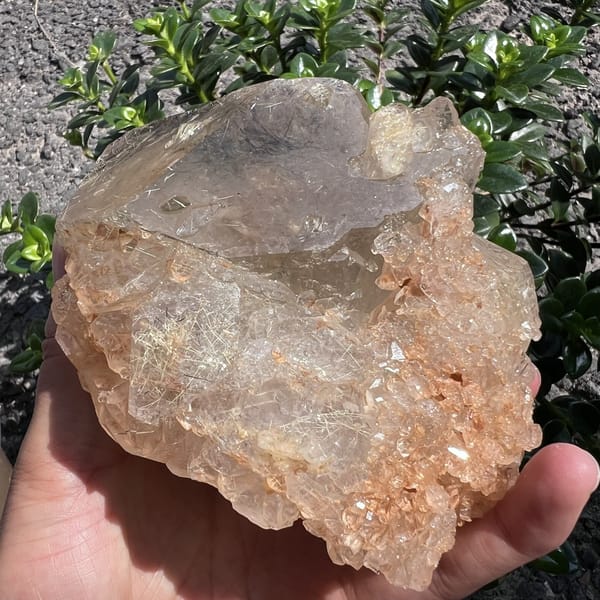 Crystal tilted showing rutile hairs and skeletal growth along the edge