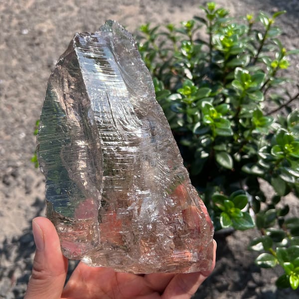 Side view with glassy faces and fine parallel etching in sunlight