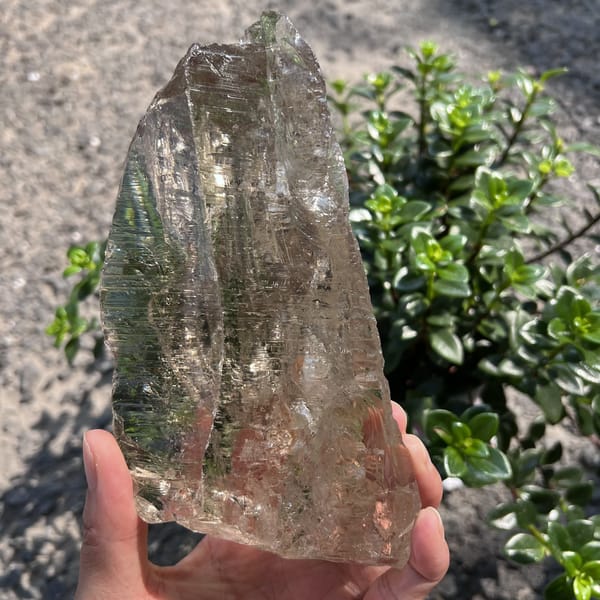 Front face of the light smoky quartz with sparkling etched ridges