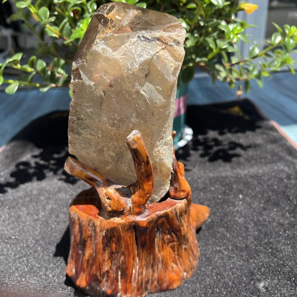 Back of the crystal showing a frosted natural surface on the stand