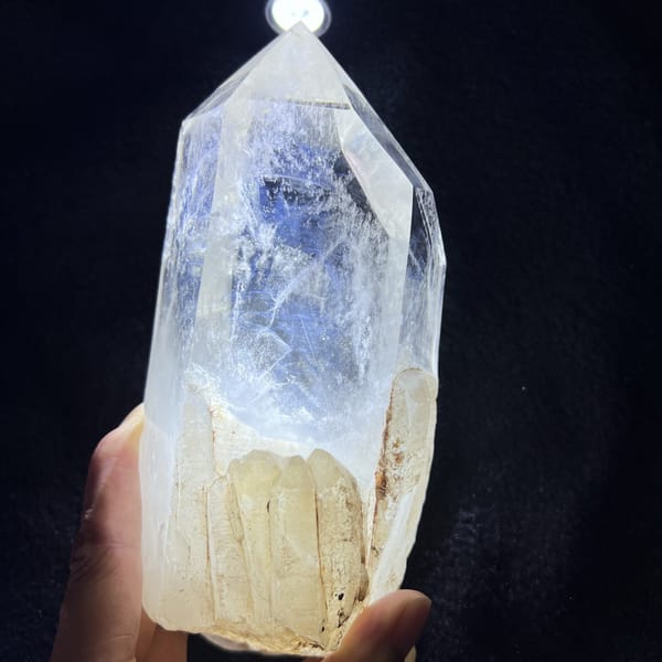 Close view of the blue needle cloud above the natural crystal base
