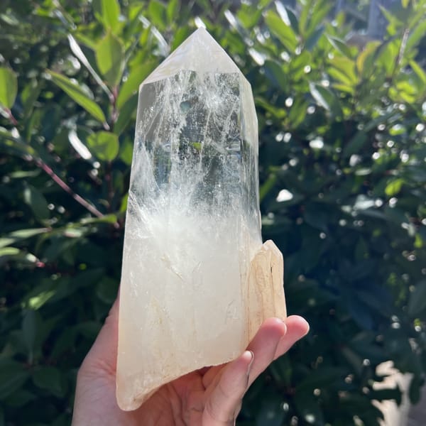 Point tilted to show the smooth faces and peach-coloured base