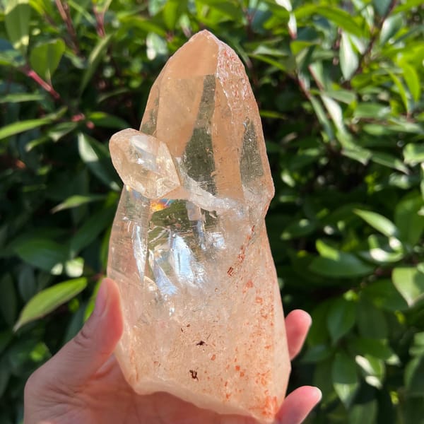 Zambian quartz with the scepter crystal on the left and reddish specks below
