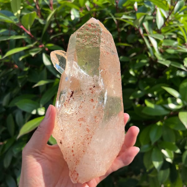Side profile of the clear quartz with scepter projecting outward near the top