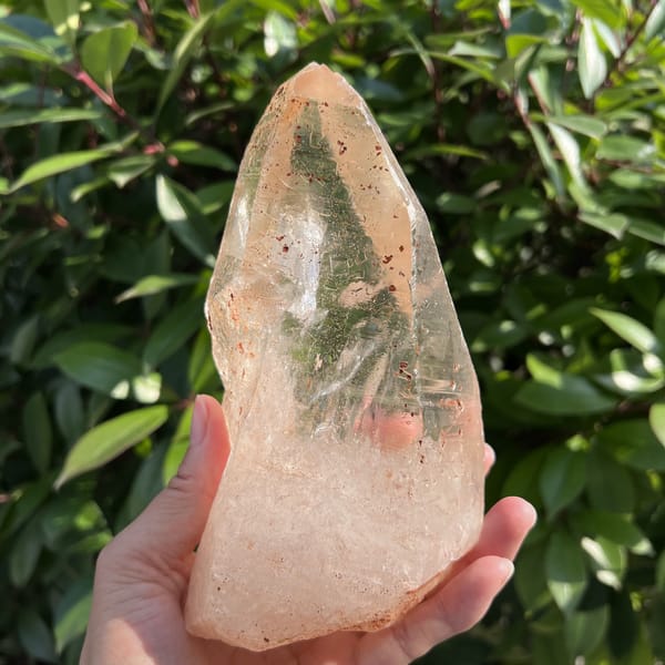 Back of the Zambian quartz showing its tall termination and rough base