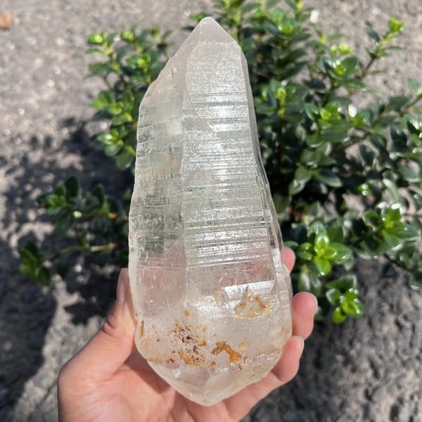 Clear quartz crystal side face packed with fine horizontal striations