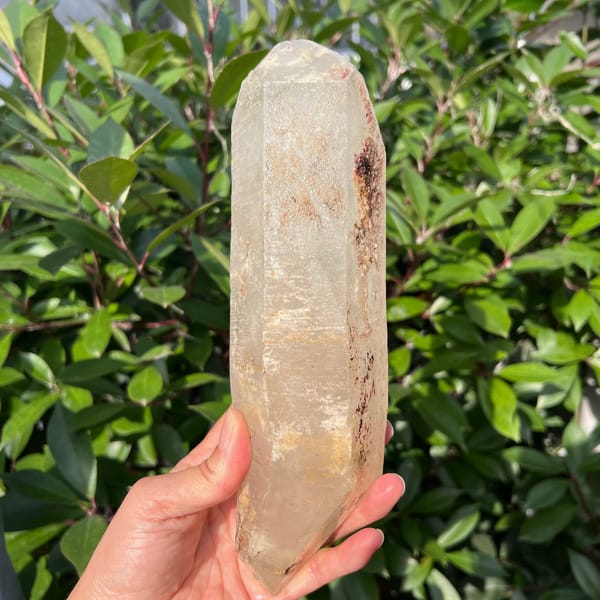 Madagascar quartz side with reddish-brown inclusion near the top