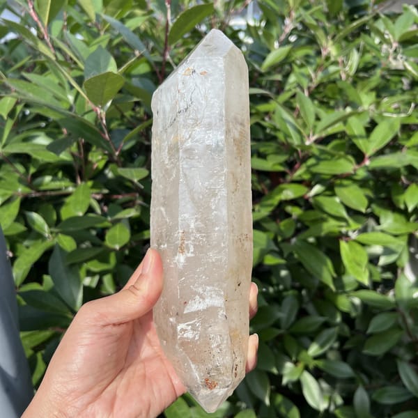 Madagascar quartz crystal with lower termination and reddish inclusions