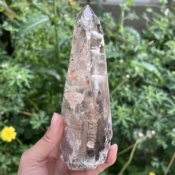 Freeform quartz turned to show grey tint and inner inclusions