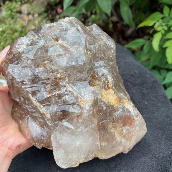 Skeletal smoky quartz turned to show a pale crystal section at the base