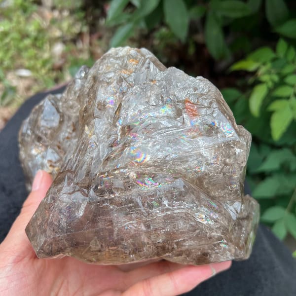 Smoky quartz from a low angle with etched faces and rainbow flashes