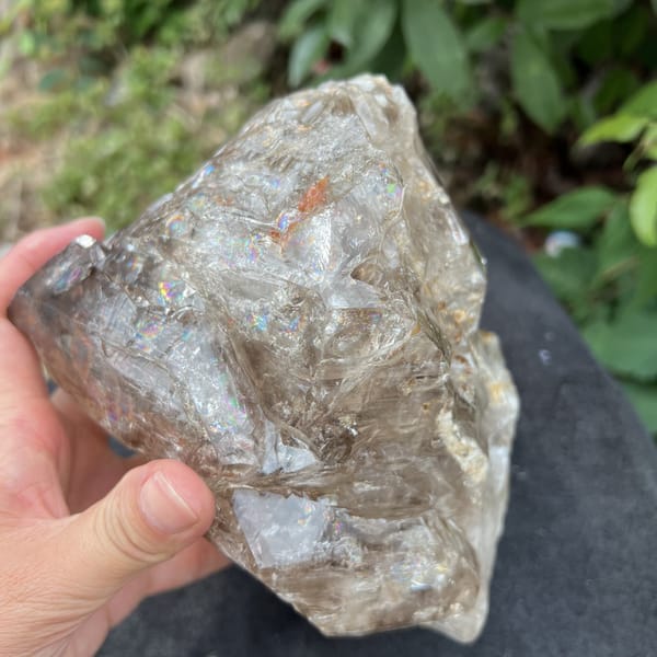 Smoky quartz tilted to show silky fluid-inclusion trails
