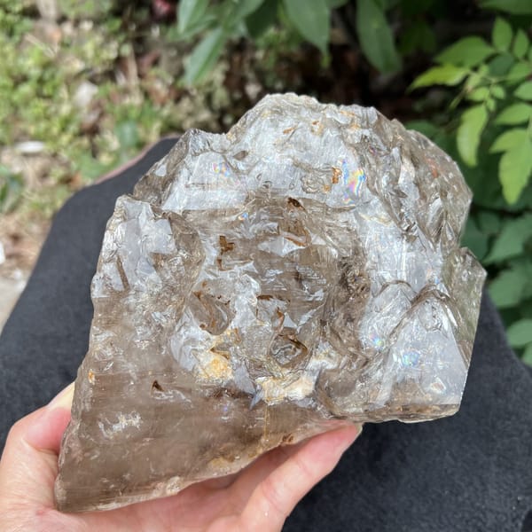 Smoky quartz from the top showing etched ridges and golden patches