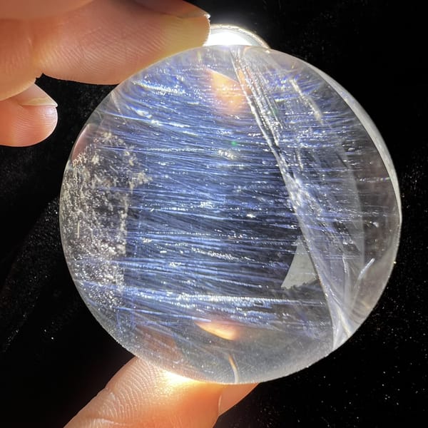 Sphere with layered blue needles and a feathery internal plane