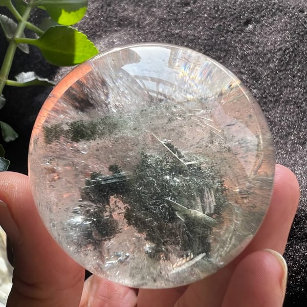 Sphere showing green phantom island and drifting green sand above