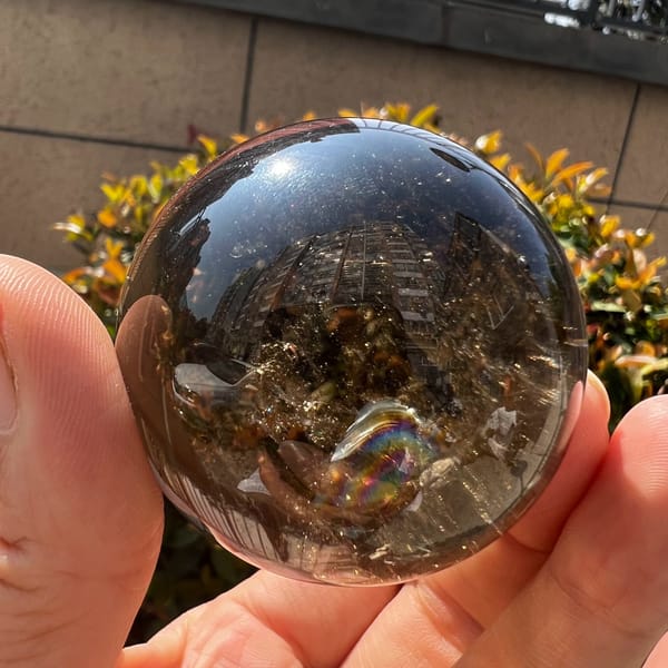 Smoky sphere with a bright rainbow near the lower centre