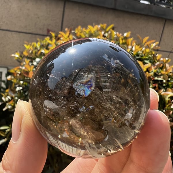 Smoky sphere showing a rainbow near the upper right
