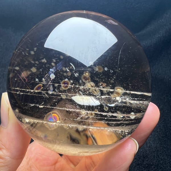 Smoky sphere showing horizontal phantom layers and starry disc inclusions