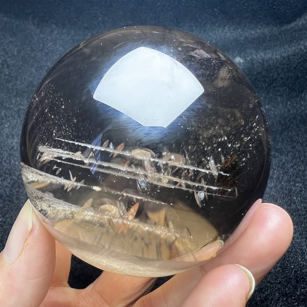 Smoky sphere showing white phantom plane and fine needle inclusions
