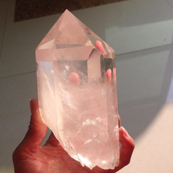 Angled view of the point showing internal veils and glassy prism faces