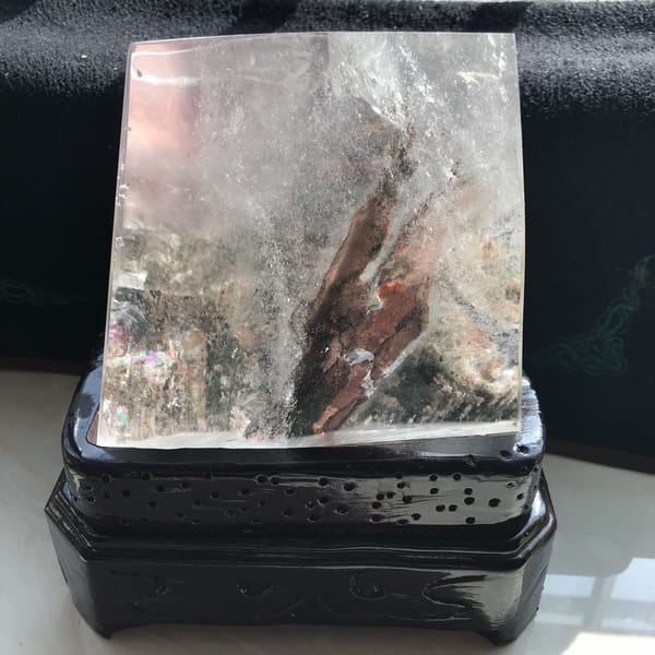 Phantom flame inside the freeform seen straight on, resting on its stand