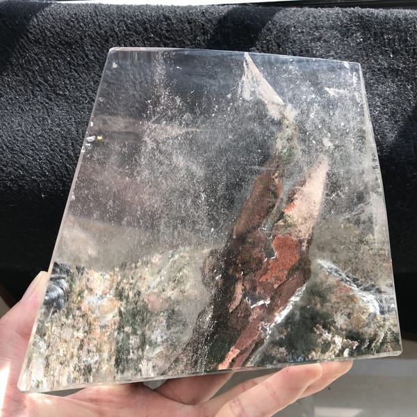 Close view of the red-brown phantom and green-grey garden layer in hand