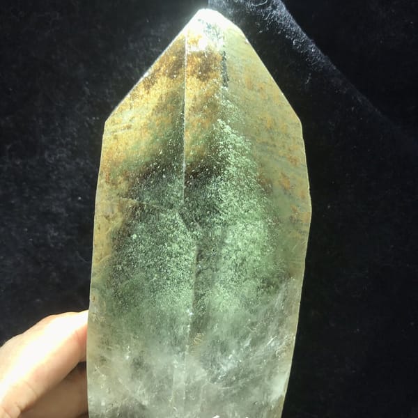 Green phantom layers and golden speckles lit from behind