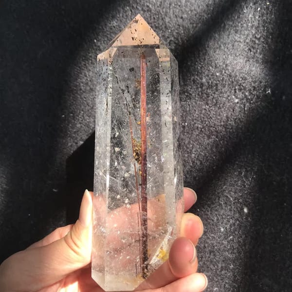 Lower half of the point with the rutile line and flat polished base