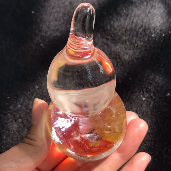 Stem end close up with red and gold inclusions glowing below