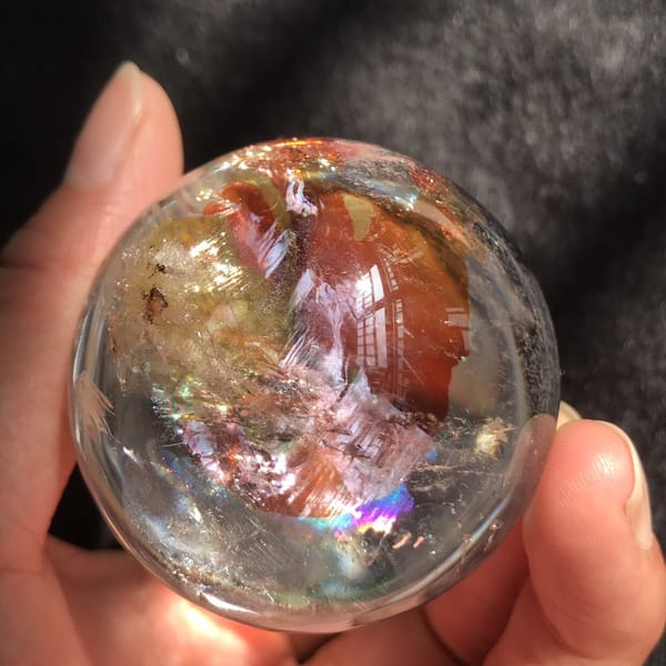 Base view of red fire quartz with violet and gold rainbow flashes