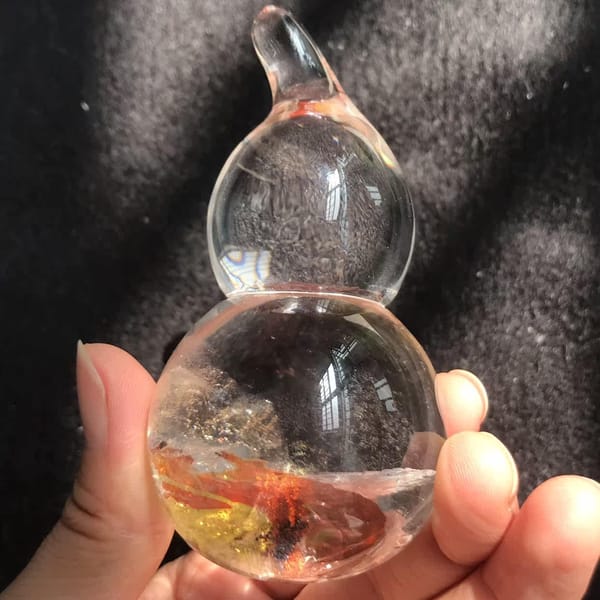 Clear upper bulb and stem above a yellow and red fire base