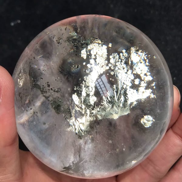 Branching chalcopyrite crown with a small round inclusion on the right