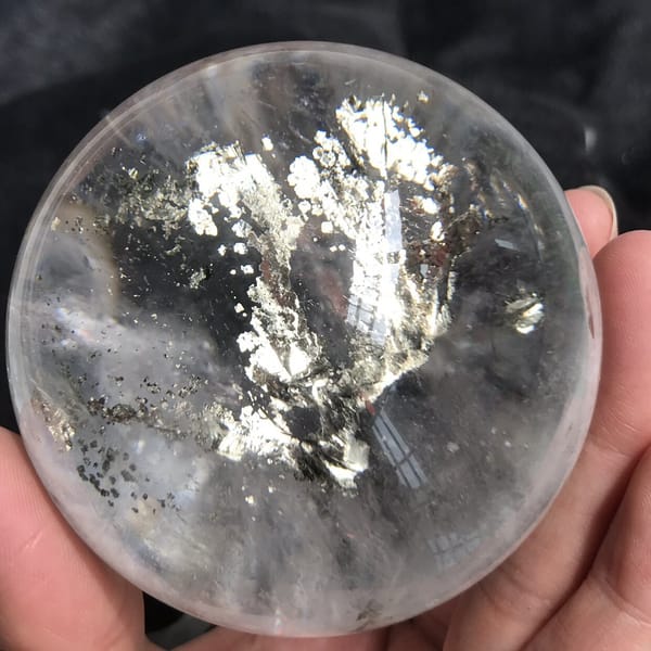 Front view of the chalcopyrite tree glowing inside polished quartz