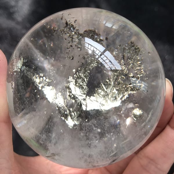 Sphere tilted to show the depth of the branching inclusion