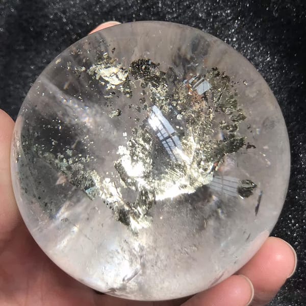 Side view of chalcopyrite flakes fanning across the sphere