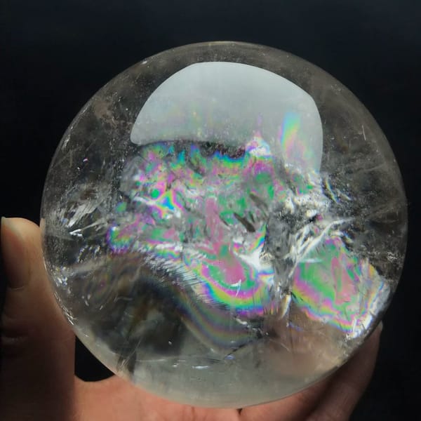 Close view of the layered rainbow and white feathers in the quartz