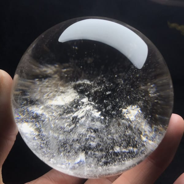 Cloudy blue-grey smoke swirling through the quartz sphere