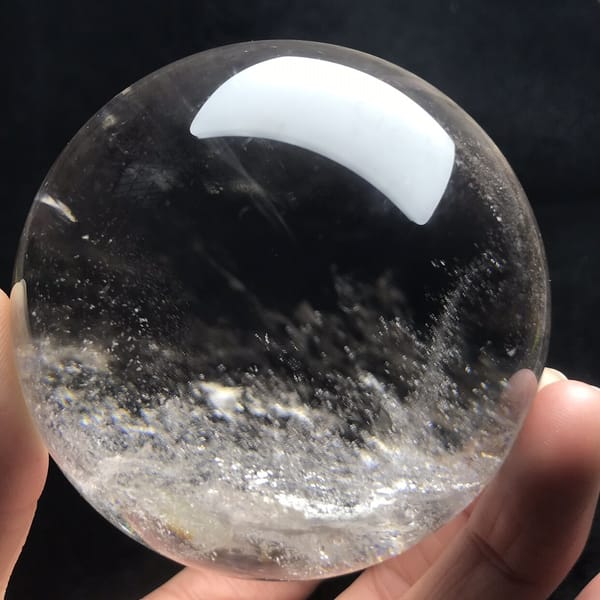 Low band of white flecks like fog over water in the quartz